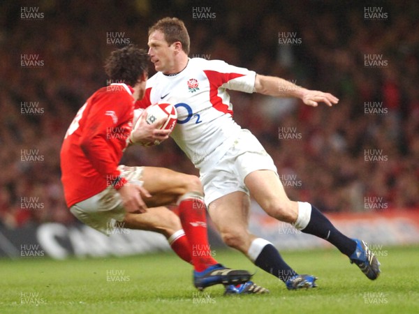 170307 - Wales v England - RBS 6 Nations -  England's Mike Catt tries to get past James Hook 