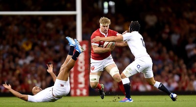 170819 - Wales v England - Under Armour Summer Series - Aaron Wainwright of Wales is tackled by Jonathan Joseph and Piers Francis of England