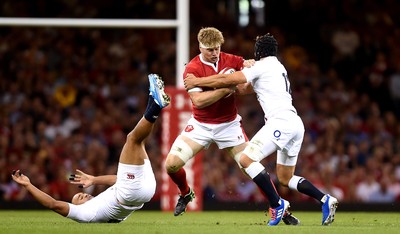 170819 - Wales v England - Under Armour Summer Series - Aaron Wainwright of Wales is tackled by Jonathan Joseph and Piers Francis of England