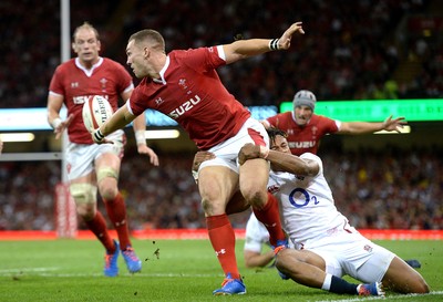 170819 - Wales v England - Under Armour Summer Series - George North of Wales is tackled by Anthony Watson of England