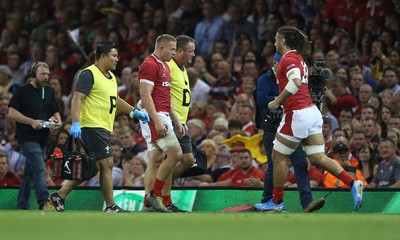 170819 - Wales v England - RWC Warm Up - Under Armour Summer Series - James Davies of Wales leaves the field injured as Josh Navidi of Wales comes on to replace him