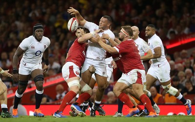 170819 - Wales v England - RWC Warm Up - Under Armour Summer Series - Ellis Genge of England is tackled by Alun Wyn Jones and Tomas Francis of Wales