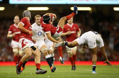 170819 - Wales v England - RWC Warm Up - Under Armour Summer Series - Leigh Halfpenny of Wales crashes to the ground after going for the high ball with Jonathan Joseph of England