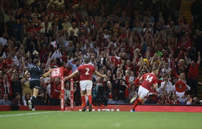 170819 - Wales v England - RWC Warm Up - Under Armour Summer Series - The fans cheer as George North of Wales runs in to score a try