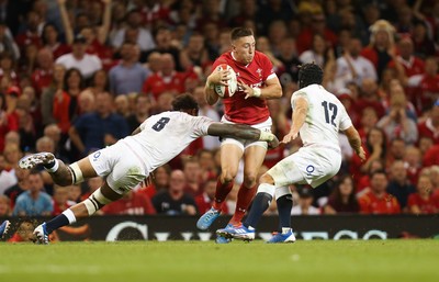 170819 - Wales v England, Under Armour Summer Series 2019 - Josh Adams of Wales takes on the English defence