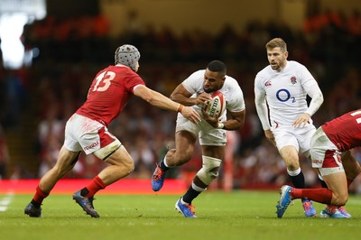 170819 - Wales v England, Under Armour Summer Series 2019 - Joe Cokanasiga of England is tackled by Jonathan Davies of Wales