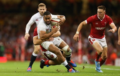 170819 - Wales v England, Under Armour Summer Series 2019 - Joe Cokanasiga of England is tackled by Jonathan Davies of Wales