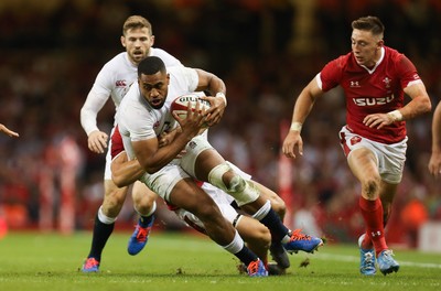 170819 - Wales v England, Under Armour Summer Series 2019 - Joe Cokanasiga of England is tackled by Jonathan Davies of Wales