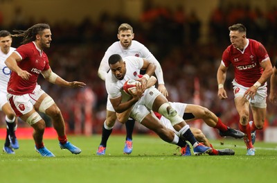 170819 - Wales v England, Under Armour Summer Series 2019 - Joe Cokanasiga of England is tackled by Jonathan Davies of Wales