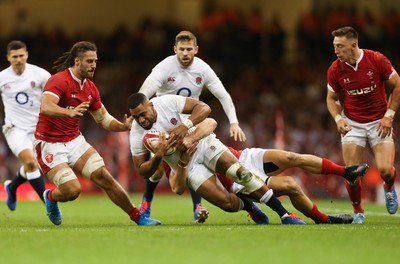 170819 - Wales v England, Under Armour Summer Series 2019 - Joe Cokanasiga of England is tackled by Jonathan Davies of Wales