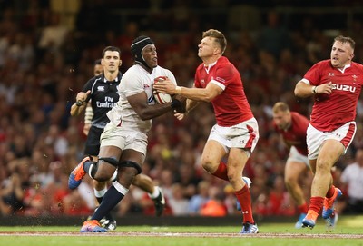 170819 - Wales v England, Under Armour Summer Series 2019 - Maro Itoje of England is tackled by Dan Biggar of Wales