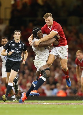 170819 - Wales v England, Under Armour Summer Series 2019 - Maro Itoje of England is tackled by Dan Biggar of Wales