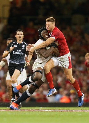 170819 - Wales v England, Under Armour Summer Series 2019 - Maro Itoje of England is tackled by Dan Biggar of Wales