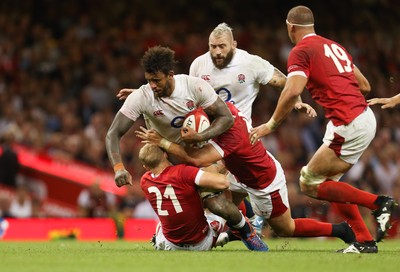 170819 - Wales v England, Under Armour Summer Series 2019 - Courtney Lawes of England  is tackled by Aled Davies of Wales and Elliot Dee of Wales