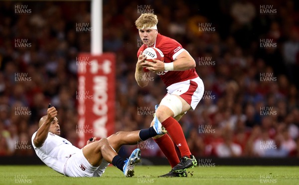 170819 - Wales v England - Under Armour Summer Series - Aaron Wainwright of Wales is tackled by Jonathan Joseph of England