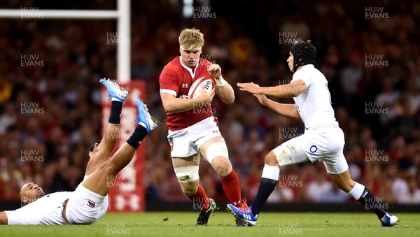 170819 - Wales v England - Under Armour Summer Series - Aaron Wainwright of Wales is tackled by Jonathan Joseph and Piers Francis of England
