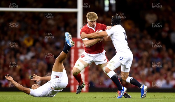 170819 - Wales v England - Under Armour Summer Series - Aaron Wainwright of Wales is tackled by Jonathan Joseph and Piers Francis of England