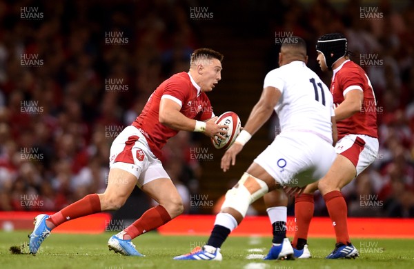 170819 - Wales v England - Under Armour Summer Series - Josh Adams of Wales looks for a way through