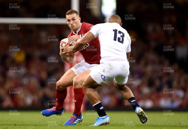 170819 - Wales v England - Under Armour Summer Series - George North of Wales is tackled by Jonathan Joseph of England