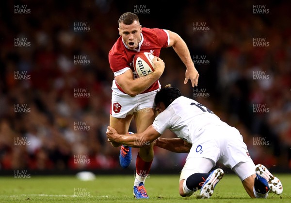 170819 - Wales v England - Under Armour Summer Series - Gareth Davies of Wales is tackled by Piers Francis of England