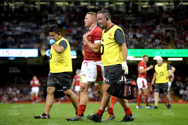170819 - Wales v England - Under Armour Summer Series - James Davies of Wales leaves the field with Dr Geoff Davies (right)