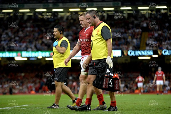 170819 - Wales v England - Under Armour Summer Series - James Davies of Wales leaves the field with Dr Geoff Davies (right)