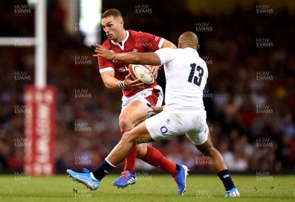 170819 - Wales v England - Under Armour Summer Series - George North of Wales is tackled by Jonathan Joseph of England