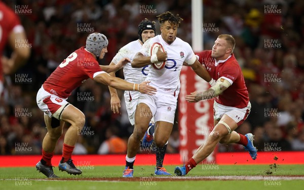 170819 - Wales v England - RWC Warm Up - Under Armour Summer Series - Anthony Watson of England is tackled by Jonathan Davies and Ross Moriarty of Wales