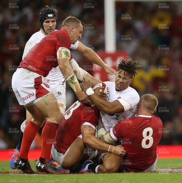 170819 - Wales v England - RWC Warm Up - Under Armour Summer Series - Anthony Watson of England is tackled by Jonathan Davies and Ross Moriarty of Wales