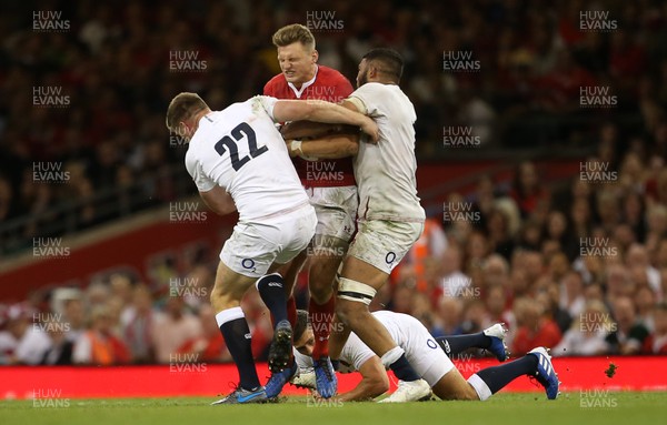 170819 - Wales v England - RWC Warm Up - Under Armour Summer Series - Dan Biggar of Wales is tackled by Owen Farrell and Lewis Ludlam of England