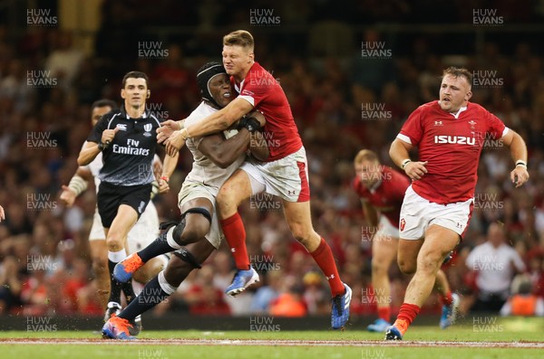 170819 - Wales v England, Under Armour Summer Series 2019 - Maro Itoje of England is tackled by Dan Biggar of Wales