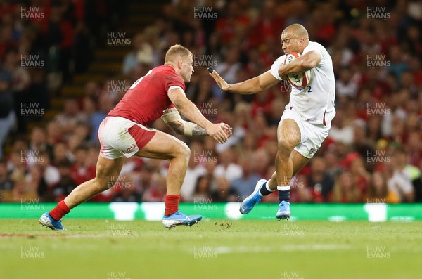 170819 - Wales v England, Under Armour Summer Series 2019 - Jonathan Joseph of England takes on Ross Moriarty of Wales