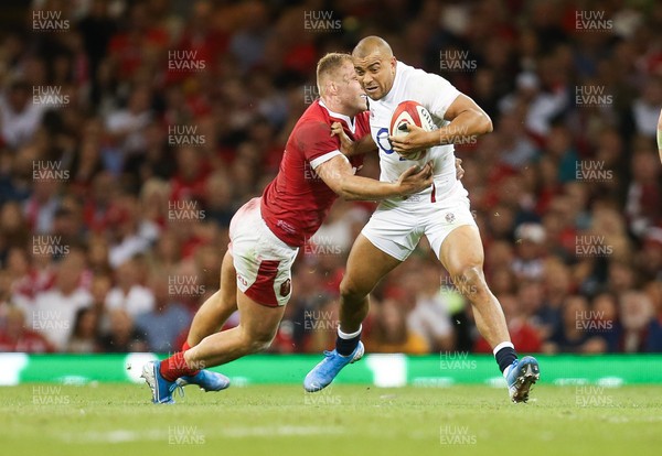 170819 - Wales v England, Under Armour Summer Series 2019 - Jonathan Joseph of England takes on Ross Moriarty of Wales