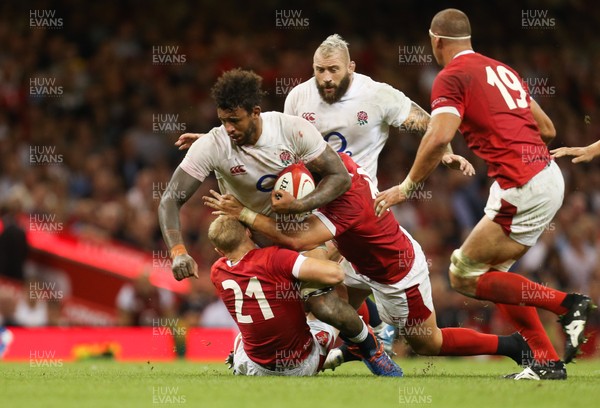 170819 - Wales v England, Under Armour Summer Series 2019 - Courtney Lawes of England  is tackled by Aled Davies of Wales and Elliot Dee of Wales