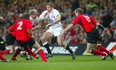 220203 - Wales v England - Six Nations Championship - England's Ben Cohen takes on Gareth Thomas and Jonathan Humphreys