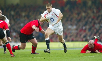 220203 - Wales v England - Six Nations Championship - England's Ben Cohen breaks away from Iestyn Thomas