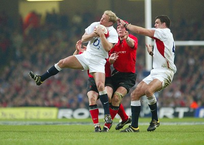 220203 - Wales v England - Six Nations Championship - England's Neil Back claims the high ball