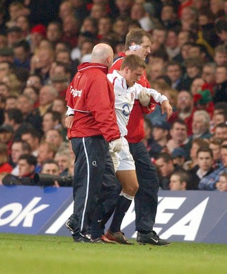 220203 - Wales v England - Six Nations Championship - England's Jonny Wilkinson leaves the field injured