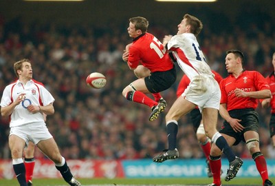 220203 - Wales v England - Six Nations Championship - Wales' Kevin Morgan and England's Will Greenwood contest ball