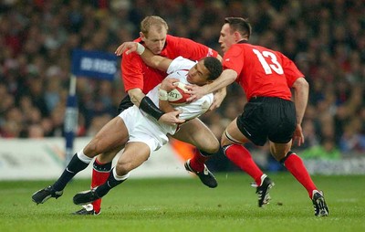 220203 - Wales v England - Six Nations Championship - England's Jason Robinson is tackled by Gareth Thomas