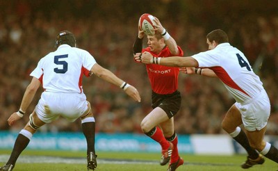 220203 - Wales v England - Six Nations Championship - Wales' Ceri Sweeney is tackled by Martin Johnson