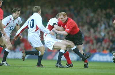 220203 - Wales v England - Six Nations Championship - Wales' Martyn Williams drives through Charlie Hodgson