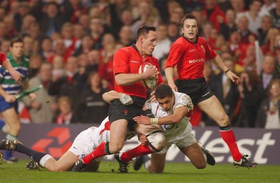 220203 - Wales v England - Six Nations Championship - England's Jason Robinson tackles Mark Taylor