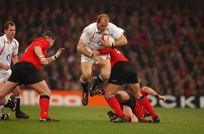 220203 - Wales v England - Six Nations Championship - England's Lawrence Dallaglio is tackled by Ben Evans