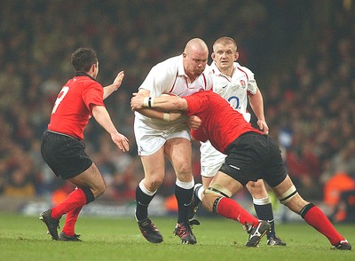 220203 - Wales v England - Six Nations Championship -  England's Robbie Morris drives into Dafydd Jones and Gareth Cooper (lt)