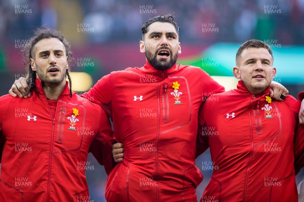 230219 - Wales v England, Guinness Six Nations  - Josh Navidi, Cory Hill and Elliot Dee of Wales sing the anthem