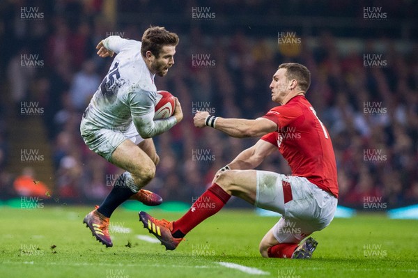 230219 - Wales v England, Guinnes Six Nations  - Elliot Daly of England tries to get past George North of Wales 