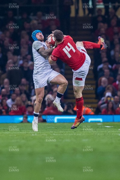 230219 - Wales v England, Guinnes Six Nations  - Jack Nowell of England trust to steal the ball from George North of Wales 