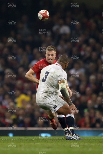 230219 - Wales v England - Guinness 6 Nations Championship - Kyle Sinckler of England blocks Gareth Anscombe of Wales as he tries to kick up field