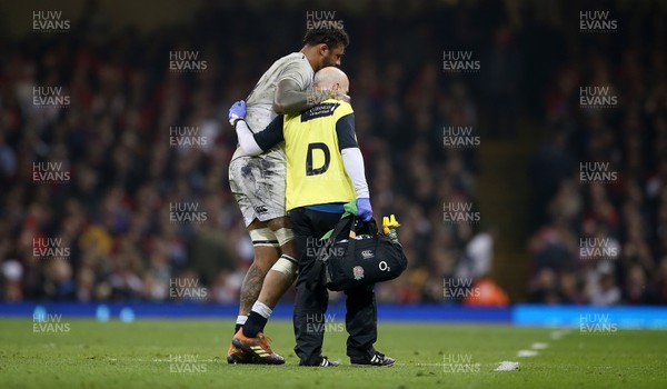 230219 - Wales v England - Guinness 6 Nations Championship - Courtney Lawes of England is carried off injured